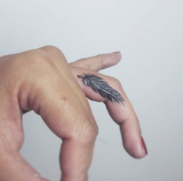 small feather finger tattoo ink youqueen girly tattoos feather  Feather  tattoo design Tattoo designs wrist Tattoo designs