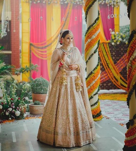 An Alibaug Wedding With A Modern Bride Who Shined In An Unconventional Lehenga Engagement Dress For Bride Golden Bridal Lehenga Bridal Outfits